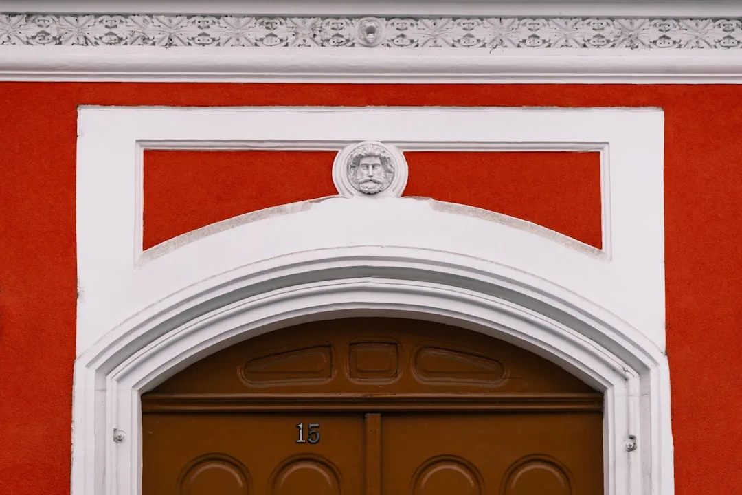 brown wooden door with white wooden frame