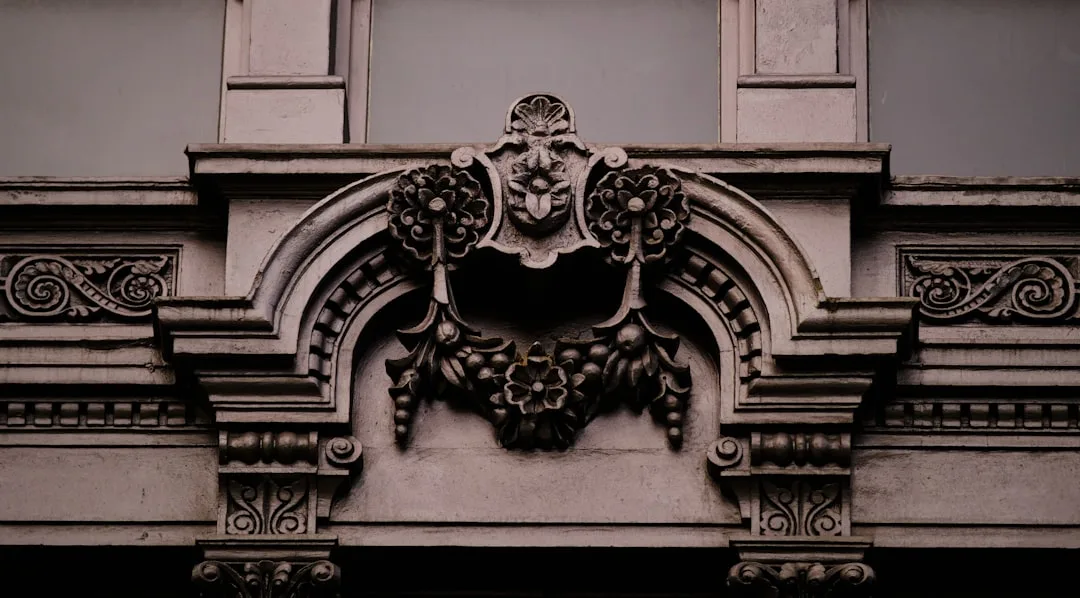 a close up of a building with a clock on the front of it